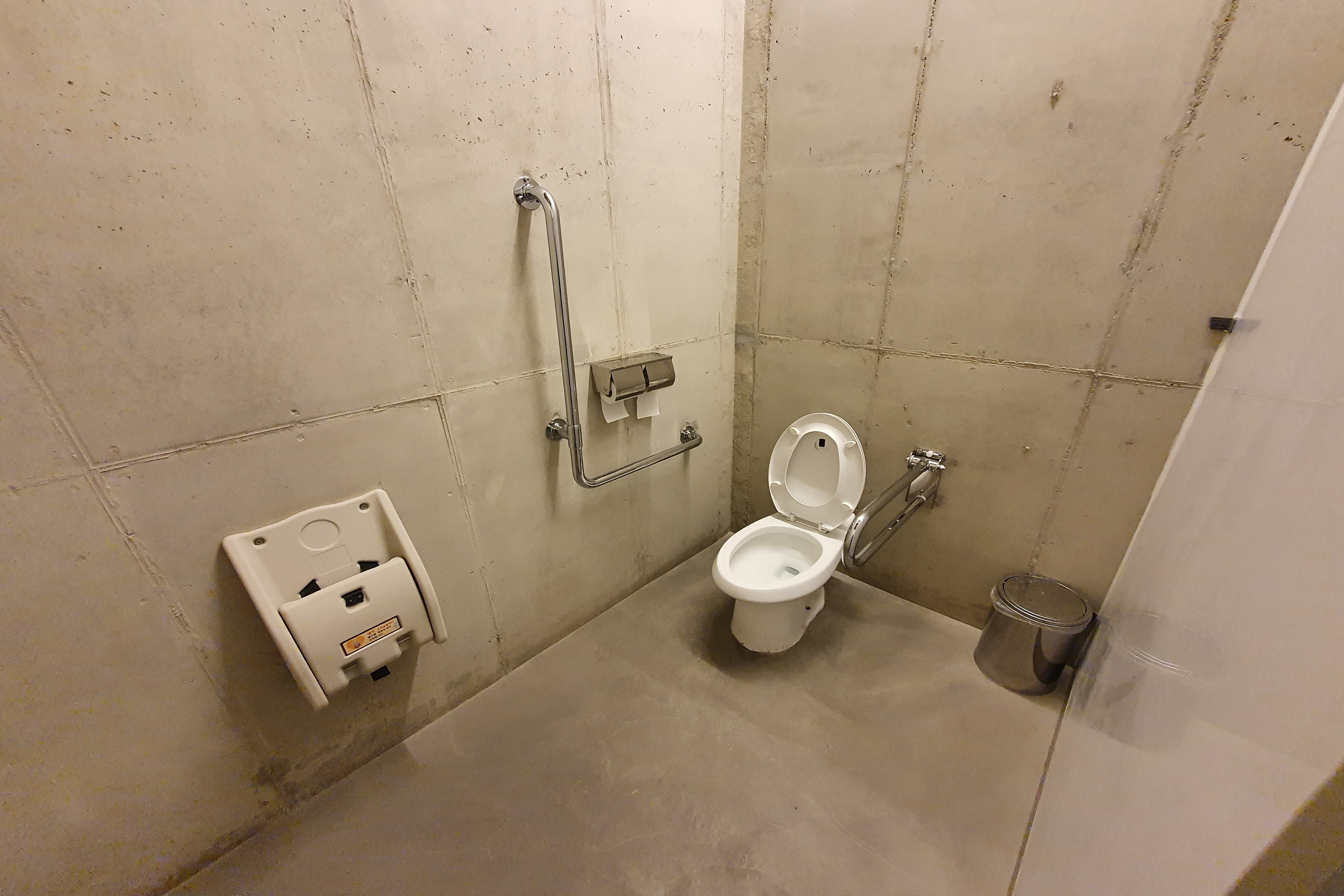Accessible Restrooms0 : The accessible toilet stall with a baby holder and grab bars 