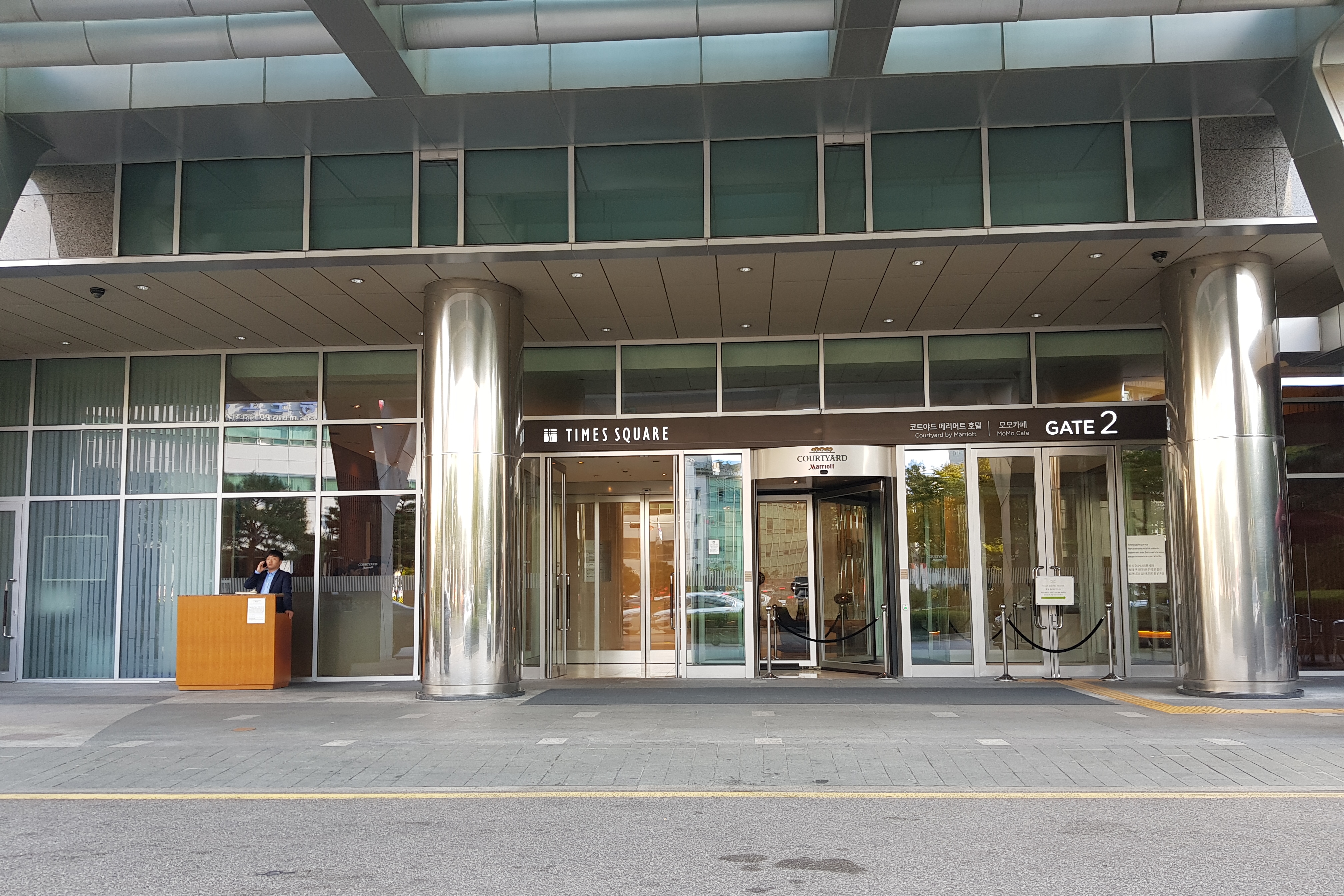 Courtyard by Marriott Seoul Times Square1 : Hotel main entrance with thick metal circular pillars at both ends