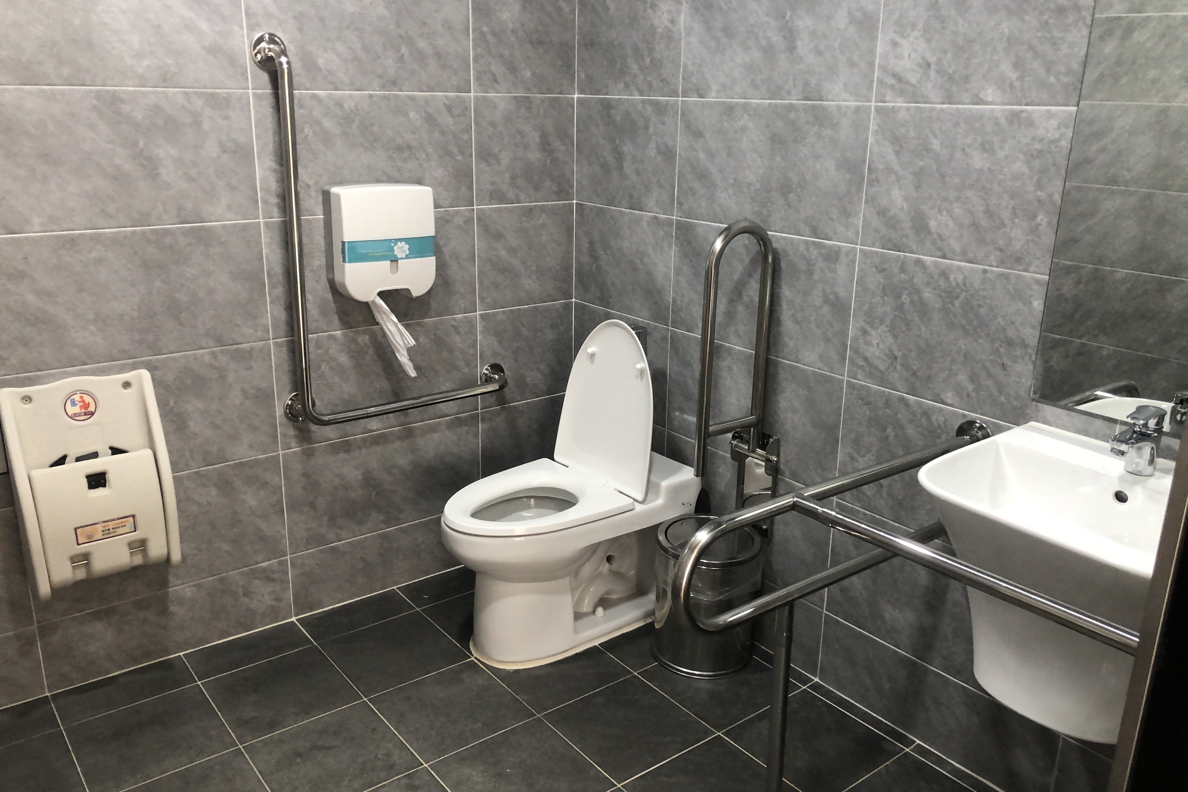 Accessible restroom for persons with disabilities0 : Accessible restroom with grab bars
